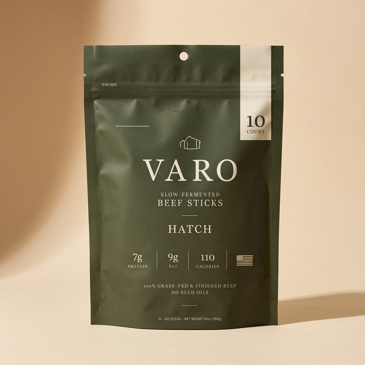 HATCH bag of VARO slow-fermented beef sticks on a sand backdrop