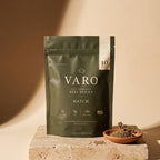 HATCH bag of VARO slow-fermented beef sticks on a travertine block beside a small terracotta dish