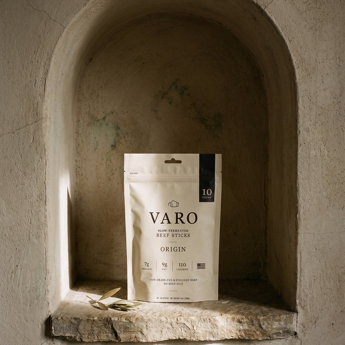 ORIGIN bag of VARO slow-fermented beef sticks in an arched stone niche